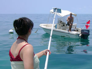 a Team OCEAN volunteer hands a boater an information packet