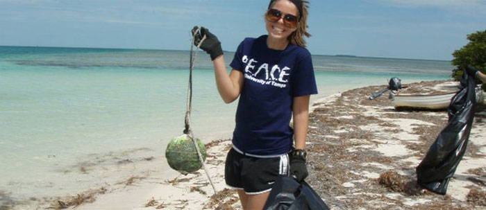 Photo of volunteer during a beach cleanup.