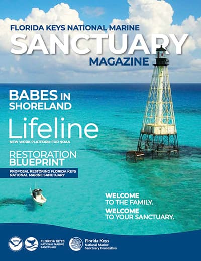 Florida Keys National Marine Sanctuary Magazine cover: a boat passing a lighthouse surrounded by water