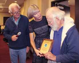 SAC member being presented a plaque