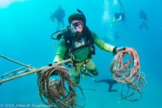Divers clean up marine debris from reefs