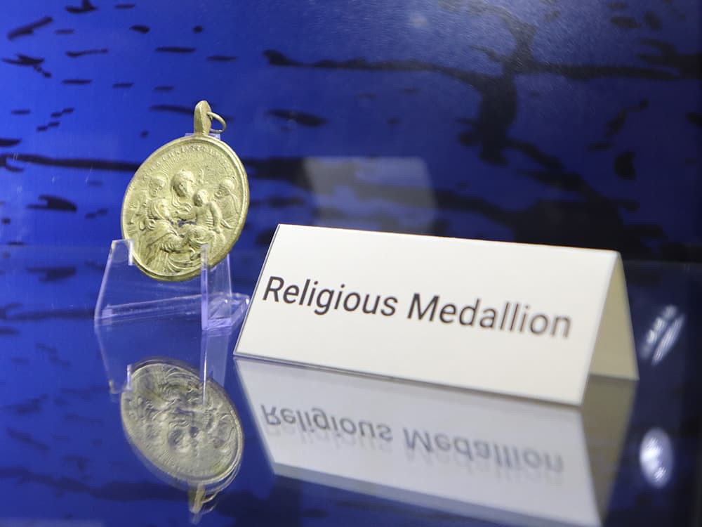 golden medallion in a case