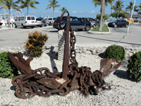 Anchor, salvaged from a ship of the 1733 fleet, resides behind restaurant at Whale Harbor in Islamorada, Fla., and is in fair condition.
